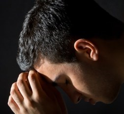 Young man in the dark
